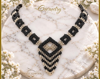 May include: A beaded necklace featuring a repeating pattern of black and metallic gold seed beads. The design includes square links leading to a central diamond-shaped pendant with a geometric arrangement of black and gold beads. The text Geometry is visible.