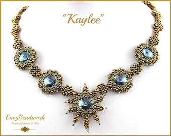 May include: A gold and blue beaded necklace with a starburst pendant. The necklace is called "Kaylee" and is made by Envy Beadwork.