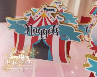 May include: A red and white striped circus tent with a blue banner that says "Nuggets". The tent is decorated with gold glitter and stars. The image is for a party or event.
