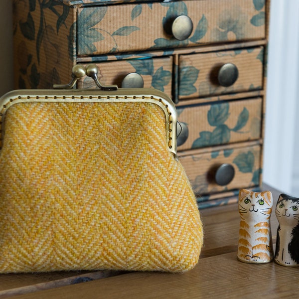 Frame purse made with buttery yellow Harris Tweed and Liberty Tana Lawn, with a hand stitched light gold coloured metal frame
