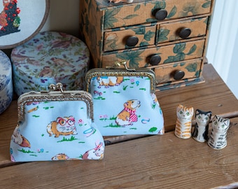 Coin purse made with very cute Guinea Pig print and a choice of 2 metallic Essex Linen linings, with a hand stitched metal frame