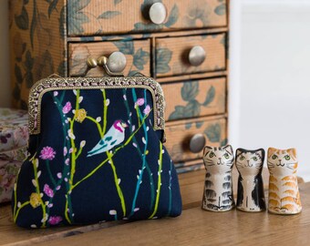 Coin purse made with lovely Bari J. cotton print outer, navy cotton interior, and a hand stitched bronze colour metal frame