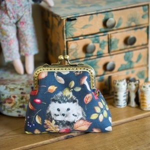 Hedgehog purse - a frame coin purse featuring Autumnal Hedgehogs on cotton, with tonal cotton lining, large enough to carry cards and cash
