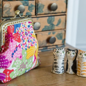 Coin purse made with Mauvey print Liberty Tana Lawn, a golden lining, and a hand stitched bronze colour metal frame image 2