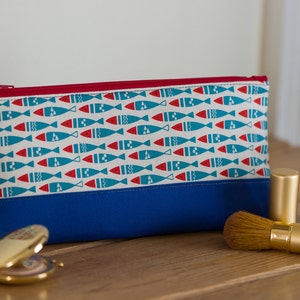 Zip pouch in a really useful size, this Red and Blue Fishes pouch is perfect as a make up bag or large pencil case