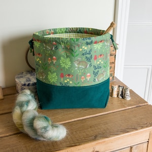 Drawstring project bag made with woodland bunny fabric, corduroy and a toning gingham lining. Perfect for any small craft project.