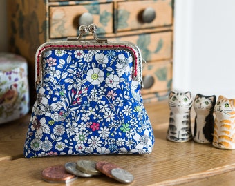 Coin purse made with Liberty tana lawn in the print: 'June's Meadow', a rich red cotton lining, and hand stitched silver metal frame