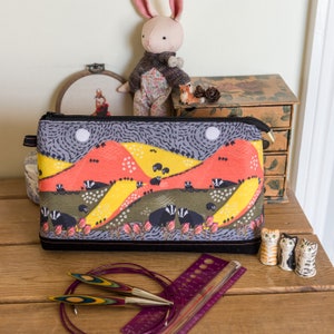 Badger print interchangeable needles bag with room for a set of interchangeable knitting needle tips, cables, accessories and roll of DPNs