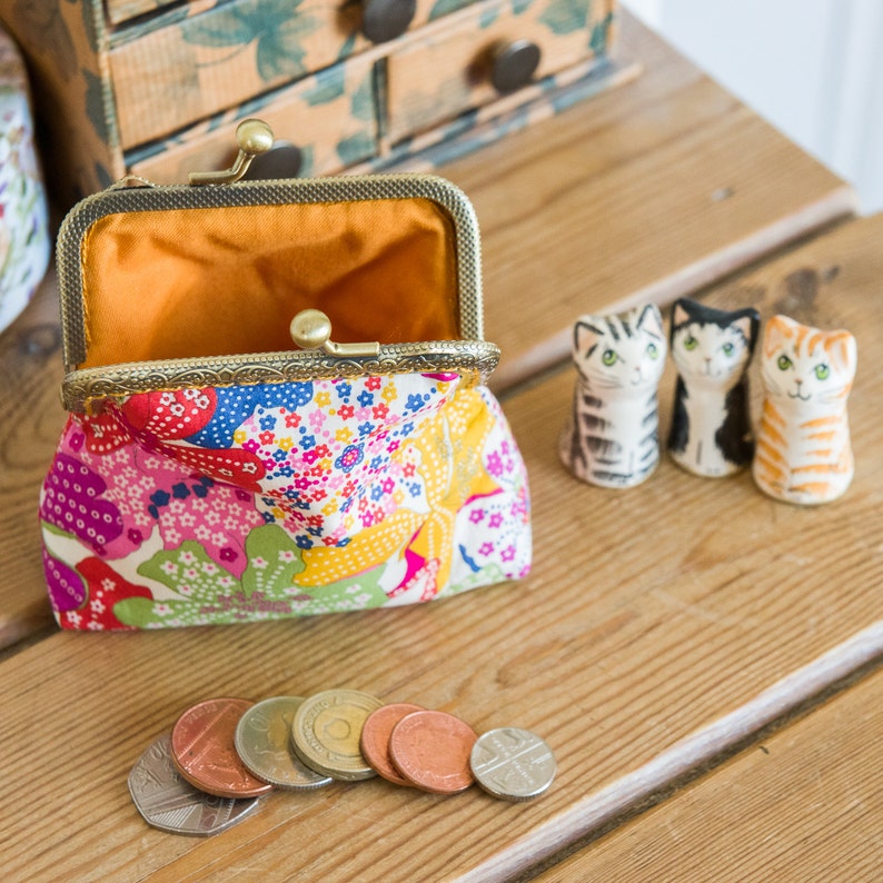 Coin purse made with Mauvey print Liberty Tana Lawn, a golden lining, and a hand stitched bronze colour metal frame image 3