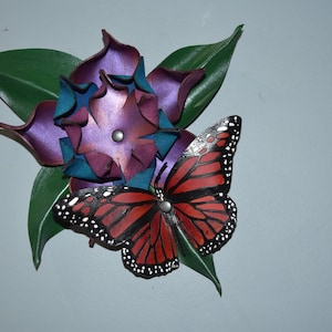Leather wall hanging, 3D butterfly on a 3D flower.