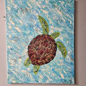 May include: An original painting of a sea turtle swimming in blue water. The turtle has a textured, dark red and brown shell, with green flippers and head. The background is a textured blue with white brushstrokes.