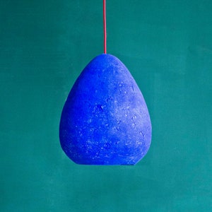Modern Ceiling Light Made from Paper Mache in ultramarine blue colour in the dining room