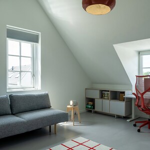 sculptural red Pendant Light made from Paper Mache called Sensi in the living room