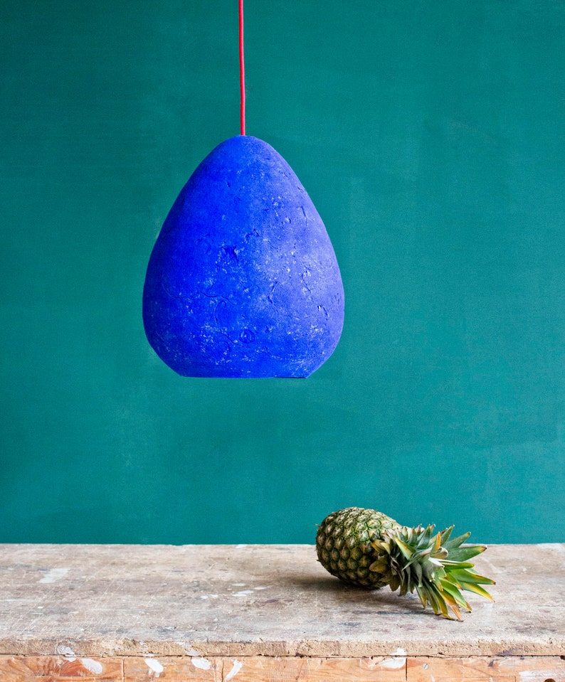 Modern Ceiling Light Made from Paper Mache in ultramarine blue colour in the dining room