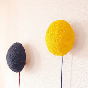 Plug in yellow Sconce Lamp Eclipse made of paper mache