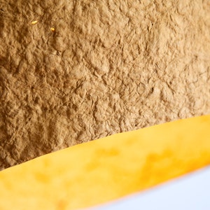 detail of big orange Pendant light Jupiter made of paper mache