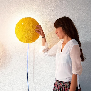 Plug in yellow Sconce Lamp Eclipse made of paper mache