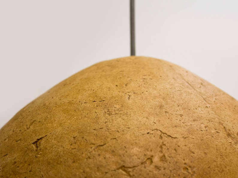 detail of Minimalist yellow Lamp for Kitchen Island made of paper mache