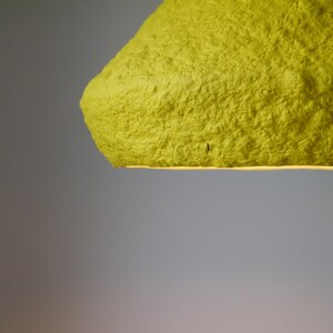 detail of Industrial yellow Lighting for Kitchen Island made with paper