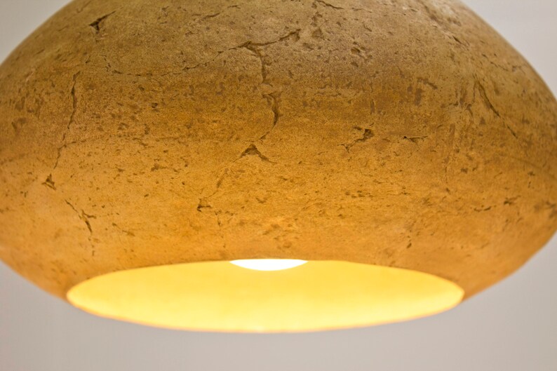 detail of Minimalist yellow Lamp for Kitchen Island made of paper mache