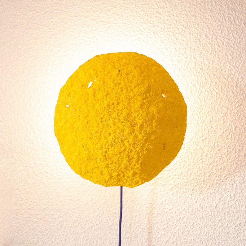 Plug in yellow Sconce Lamp Eclipse made of paper mache