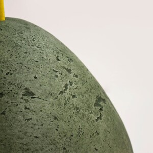 detail of Modern green Pendant Light made of paper mache