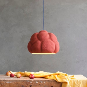 sculptural red Pendant Light made from Paper Mache called Sensi in the dining room