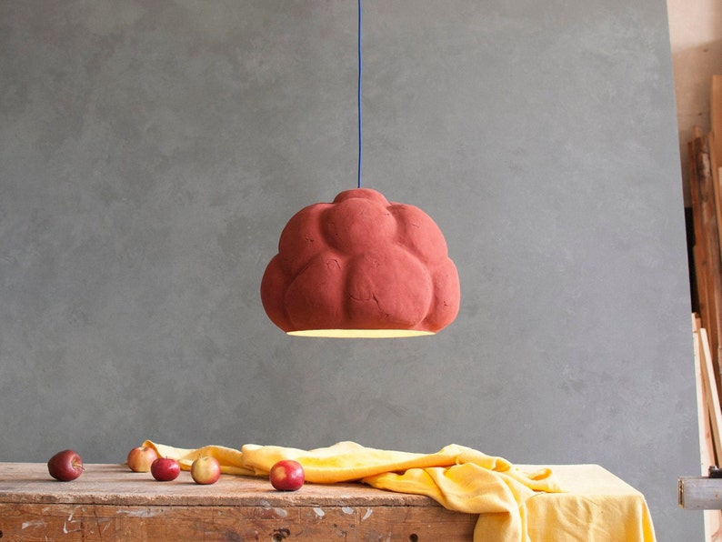 sculptural red Pendant Light made from Paper Mache called Sensi in the dining room