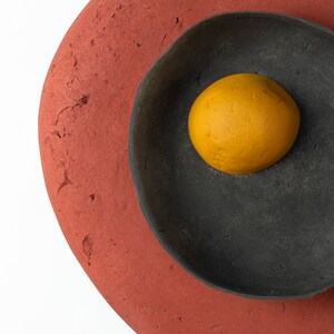 detail of the Plug in Wall Sconce Lamp from Paper Mache in red colour