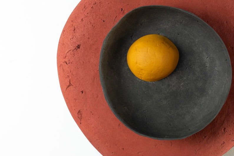 detail of the Plug in Wall Sconce Lamp from Paper Mache in red colour