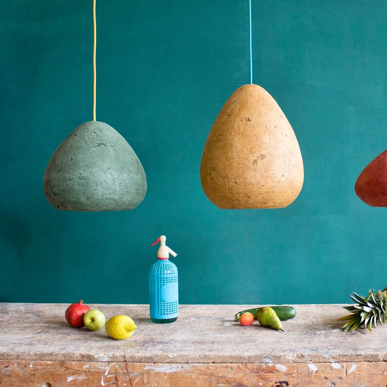 Modern Pendant Light made of paper mache above the kitchen table