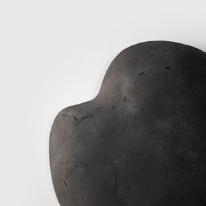 detail of black Wall Lamp for Bedroom made of papier mache