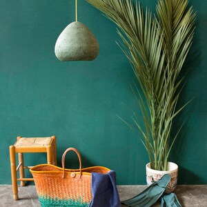 Modern green Pendant Light made of paper mache in the living area