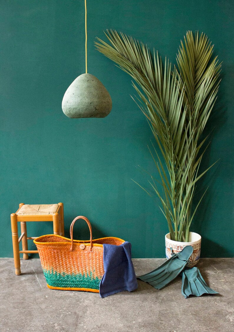 Modern green Pendant Light made of paper mache in the living area