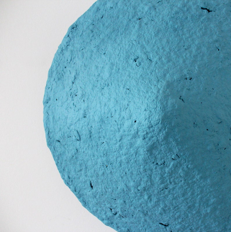 detail of Rustic Sconce Lamp made from Paper Mache in blue colour