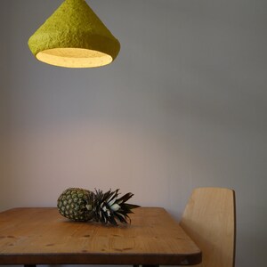 Industrial yellow Lighting above Kitchen table made with paper
