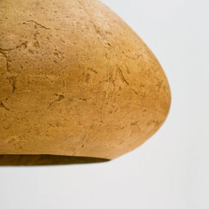 detail of Minimalist yellow Lamp for Kitchen Island made of paper mache