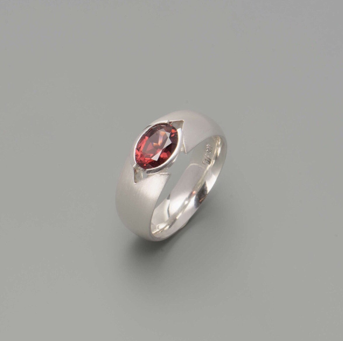 Silver ring with garnet