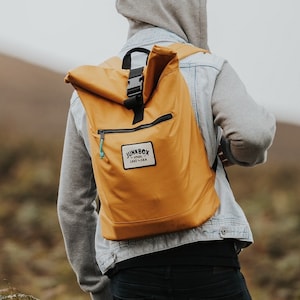 The Adventurer Recycled Roll-Top Backpack in Mustard college bag, school bag, rucksack, travel bag, mens bag, ladies bag, cabin bag image 1