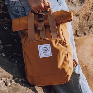 The Mini Recycled Roll-Top Backpack in Mustard college bag, school bag, backpack, travel bag, mens bag, ladies bag, cabin bag image 1