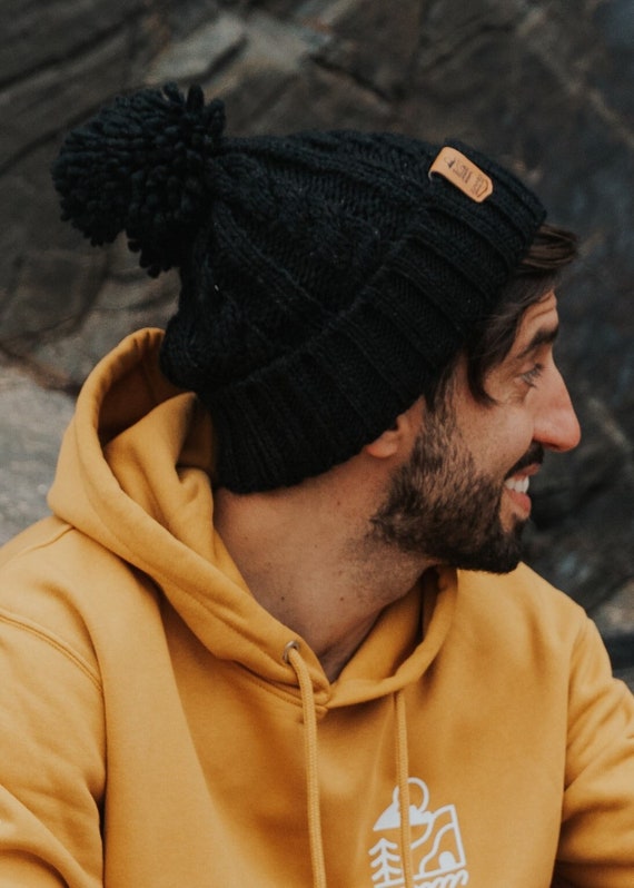 black bobble hat with brown bobble