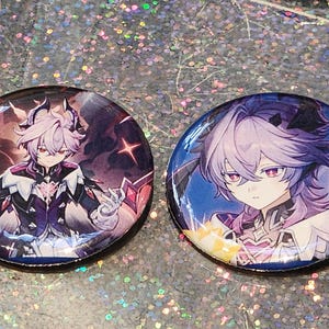 May include: Two round buttons featuring anime-style character illustrations. One button has a character with red eyes and white hair, wearing a black and white outfit. The other button has a character with purple hair and eyes, set against a blue background.