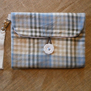 Waterproof changing mat with storage pockets and stroller strap