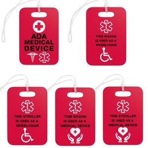 May include: Six red luggage tags with white text and symbols. The tags read "ADA Medical Device", "This Wagon is Used as a Wheelchair", "This Stroller is Used as a Wheelchair", "This Wagon is Used as a Medical Device", and "This Stroller is Used as a Medical Device".