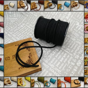 May include: A collage of images showing different colors of cord, with a spool of black cord in the center. The cord is made of a soft, flexible material and is perfect for crafting projects.