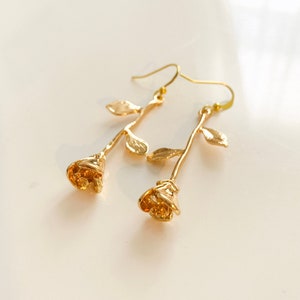 Gold Rose Stem dangling earring