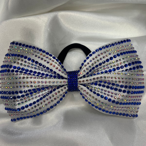 White satin and rhinestone tailless hairbow. Free gift with every purchase. Scrunchie or rhinestone ponytail cuff, gifts chosen at random.