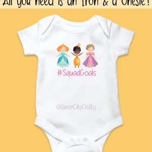 May include: White onesie with a graphic of three girls in princess dresses. The text "#SquadGoals" and "@QueenCityCrafty" are printed on the onesie.