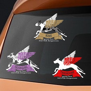 May include: Three car decals with images of dogs with wings and the words "King gone but never forgotten", "Good girl gone but never forgotten", and "Theodore gone but never forgotten".