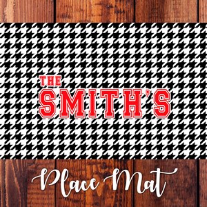 May include: Black and white houndstooth place mat with the text "THE SMITH'S" in red.